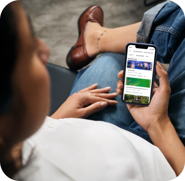 Woman looking at Egym Wellpass app